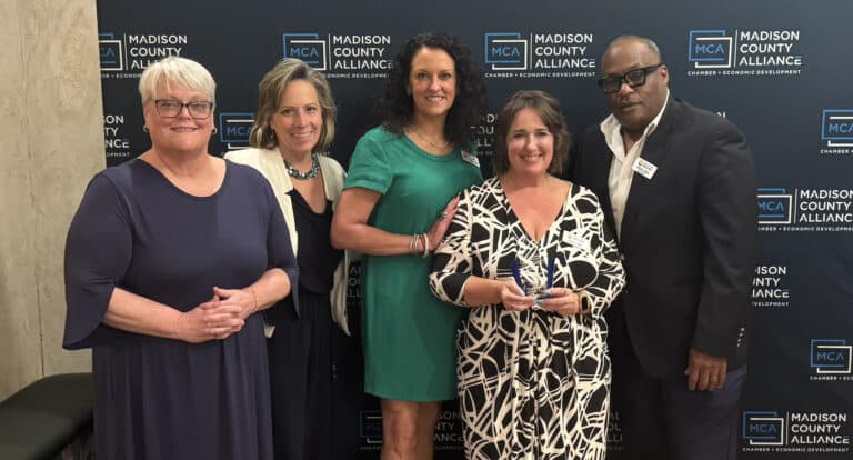 HIUW board and staff accept Non-Profit of the Year award